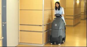 Step-on scrubber drier