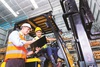 operator and supervisor with clipboard - med