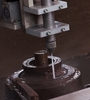 Abrasive suspension optimised